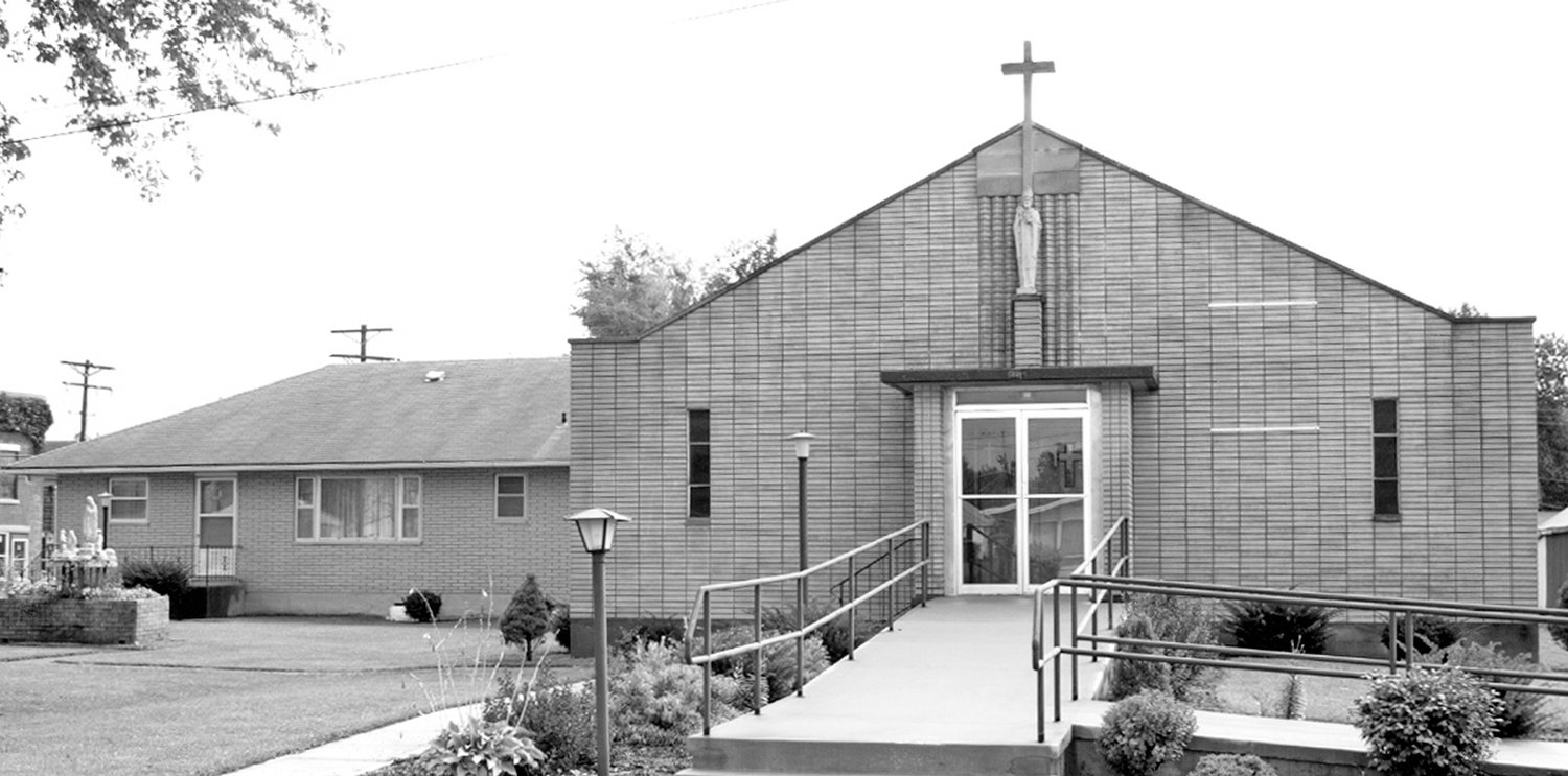 The St. Patrick Parish Rectory in Clarence, shown here on the left adjacent to the church, is being converted to transitional housing for mothers and children in need, with help from a Charity and Mercy Grant from Catholic Charities of Central and Northern Missouri.